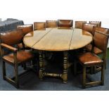 A heavy quality Jacobean style dining room suite, in oak and elm, comprising a wake style oval drop