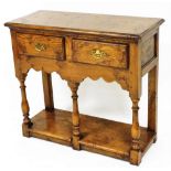 A Titchmarsh Goodwin side table, of rectangular form, with two frieze drawers, on baluster legs, ter