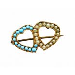 A twin heart brooch, set with imitation turquoise and seed pearl in copper backing, on single pin ba