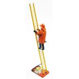 A mid 20thC MAR Toys wind up The Climbing Fireman toy, the fireman 21cm high.