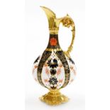 A Royal Crown Derby porcelain Imari pattern ewer, with gilt highlights on a shaped base, red stamp t