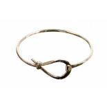 A hoop and loop bracelet, white metal, marked 925, 6cm wide.