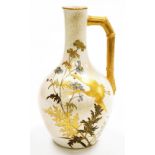 A Royal Worcester porcelain jug, on cream ground, heavily gilt decorated with storks and floral spra