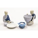 Three Lladro porcelain ornaments, comprising a Lladro figure of a seated monk with bowl, 14cm high,