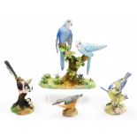 A collection of matt porcelain bird figure groups, to include a Crown Staffordshire Budgerigar group