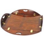 A Georgian style mahogany butlers tray, of shaped rectangular form, with moulded handles, 14cm high,