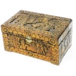 A heavily carved Oriental design box, profusely decorated with buildings, figures, and trees, with a