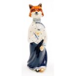 A Rye pottery fox figure, of a female fox in dark blue flowing dress signed LB, 23cm high.