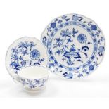 A Meissen Onion pattern trio, comprising a blue and white cup and saucer, each with floral scrolled