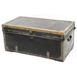 A 19thC crest leather studded and metal bound trunk, of rectangular form, with side carrying handles