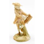 A Royal Worcester blush ivory porcelain figure of a boy, writing in a book and leaning against a tre