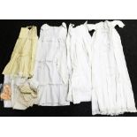 Various christening and day gowns, to include three christening robes made by Elsie Weldon for her c