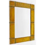 An Arts and Crafts design brass framed rectangular wall mirror, with raised ball decoration, 58cm x