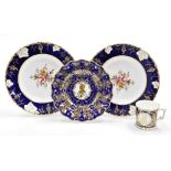 A collection of Royal Crown Derby porcelain, a pair of cabinet plates with a dark blue and gilt high