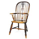 A 19thC ash and elm Windsor chair, with a pierced splat, solid seat on turned legs with H stretcher,