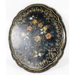 A late Victorian papier mache table top or stand, of floral shaped oval form, painted with flowers,