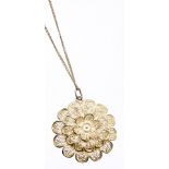 A filigree pendant and chain, the three layered filigree floral pendant, 3.5cm high, on a fine link