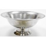 A large base metal centrepiece bowl, of circular form, on compressed stem and circular foot, partial