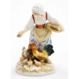 A Meissen porcelain figure group, of a young girl feeding cockerel, chicken and chicks, on a gilt hi