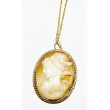 A 9ct gold shell cameo pendant and chain, the cameo depicting maiden looking left, 3cm x 2cm, in a f