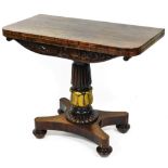 A Regency rosewood fold over card table, on a heavy reeded acanthus leaf stem, terminating in an inv