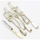 A set of five Victorian silver fiddle pattern forks, London 1859 and 1865, 6¾oz, 17cm long, and a bu