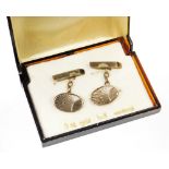 A pair of 9ct gold cufflinks, each with oval shield with engine turned fan decoration on bar back wi