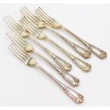 A set of six George V silver table forks, each handle decorated with leaves, flowers, scrolls, etc.,