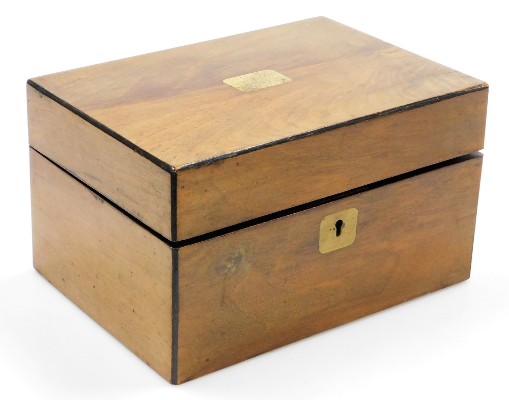 A 19thC walnut jewellery box, of rectangular form with metal escutcheon and cartouche, with part fit