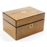 A 19thC walnut jewellery box, of rectangular form with metal escutcheon and cartouche, with part fit