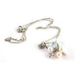 An 18ct white gold pearl diamond and blue topaz pendant and chain, the cluster design with three pal