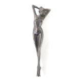 An Art Deco style figure of a nude female, with hands to her head, unsigned, 29cm high.