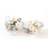 A pair of 18ct white gold pearl diamond and blue topaz earrings, each of cluster designs set with tw