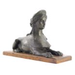 A 19thC Grand Tour style bronze patinated type spelter sphinx figure, partially textured on oak base