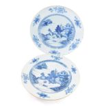 A pair of 18thC English tin glazed Delft plates, in the Chinese style painted with trees, pagoda and