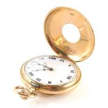 A 9ct gold half hunter pocket watch, the outer casing with blue enamel Roman numerals, opening to re