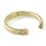 A cast copper alloy torque bangle, partially textured with shaped ends, of C shaped form, found in w