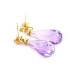 A pair of amethyst and diamond earrings, each briolette cut amethyst with a diamond set bow top, in