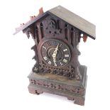 A 19thC Black Forest cuckoo clock, the angular top raised above a 15cm diameter, Roman numeric dial,