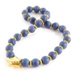 A dyed lapis lazuli beaded necklace, with yellow gold compressed bead rondel spaces, with a detachab