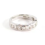 A Wempe diamond half hoop ring, channel set with eight square cut diamonds each approximately 3mm sq