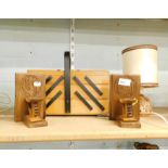 A pair of wooden book ends and a cantilever sewing box.