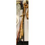 Walking sticks, to include horse head example, another with silver top of ebonised tapering form, et