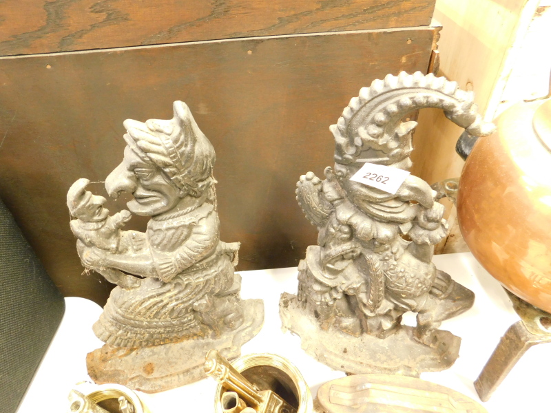 A pair of cast iron Punch and Judy doorstops.