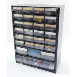 A set of metal filing drawers, with various kit building accessories, to include radiators, chassis,