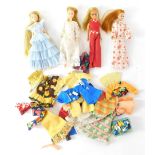 Four Pippa dolls, to include one in blue ruffled dress numbered 43 2, white dress numbered 3371, a w