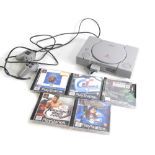 A Sony Playstation 1, with controller, and five games, Grand Tourismo II, Popelovs The Beginning, To