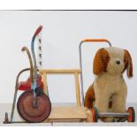 A Tri-ang scooter, push along dog, and a push along ABC baby walker. (3)