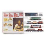 A Lima part train set, comprising diesel locomotive, trucks, brake van and various track, in partial