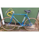 An Elswick Puma racing bike, with 24" blue frame, with a Rocket seat.
